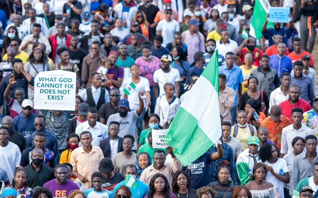 Nigerian kid boy on flag of Nigeria background. Education and childhood