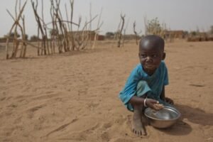 Young guardian supporting siblings after being abandoned by parents, struggling to provide food and education through manual labor.