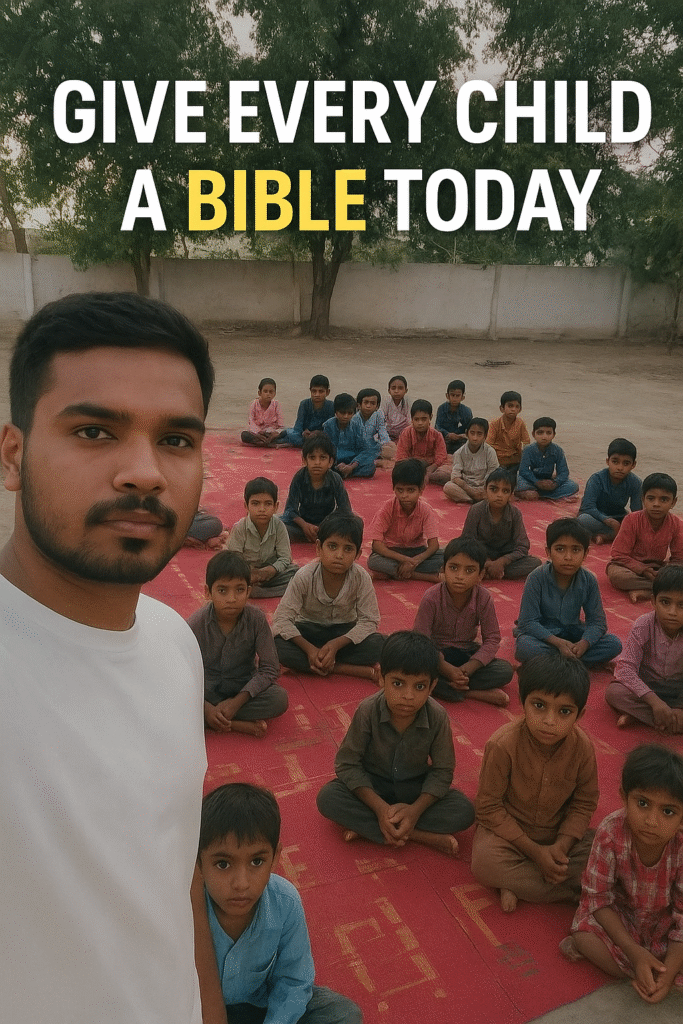 Pastor Sahil stands in front of a group of children seated on a red mat outdoors, with text reading “Give Every Child a Bible Today.